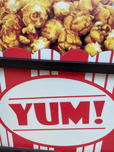 Load image into Gallery viewer, Yum! on a sign in store window with caramel popcorn on top
