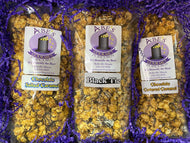 contents of Classic Chocolates gift box: 1 bag of Chocolate Salted Caramel, 1 bag of Black Tie Popcorn, 1 bag of Chocolate Covered Caramel popcorn